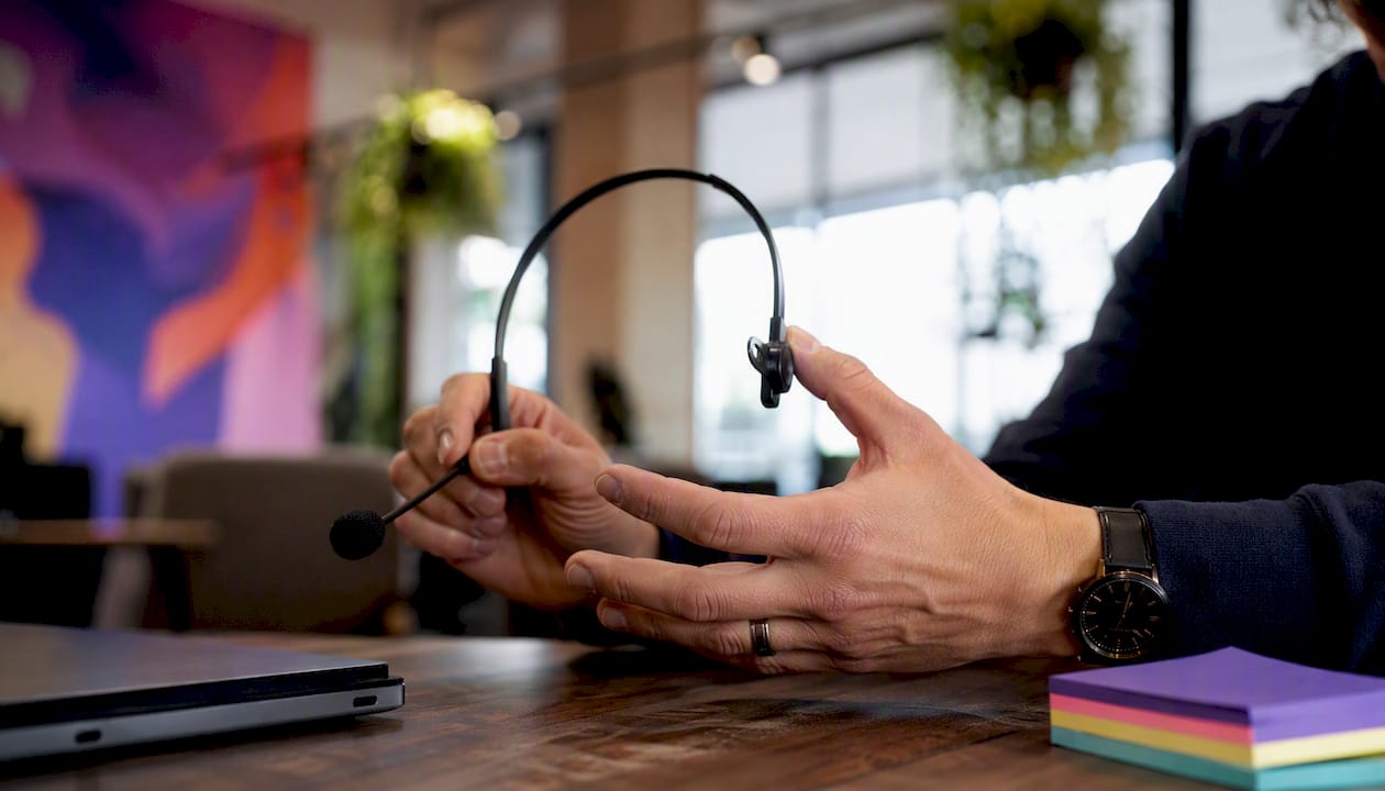 Sales coach's hands demonstrating call drill
